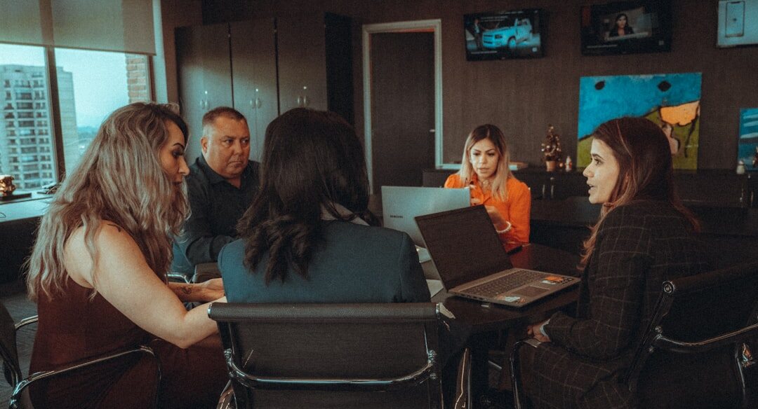 Team of journalists working together in a newsroom