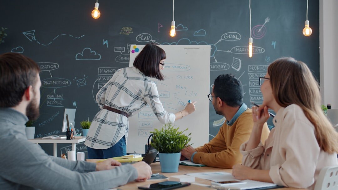 Trainer explaining reporting techniques to a small group