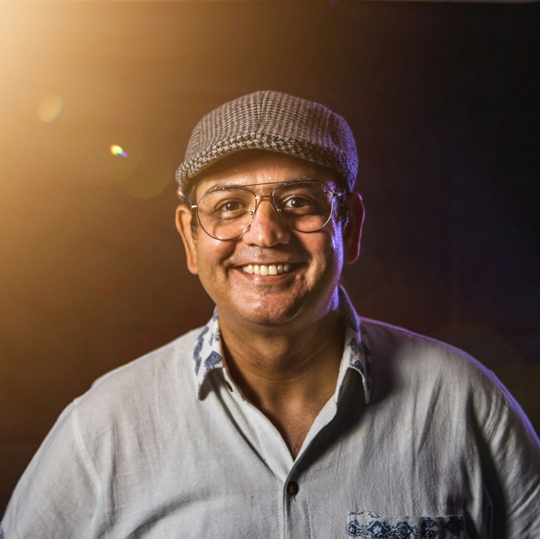 Portrait of a senior journalist with glasses