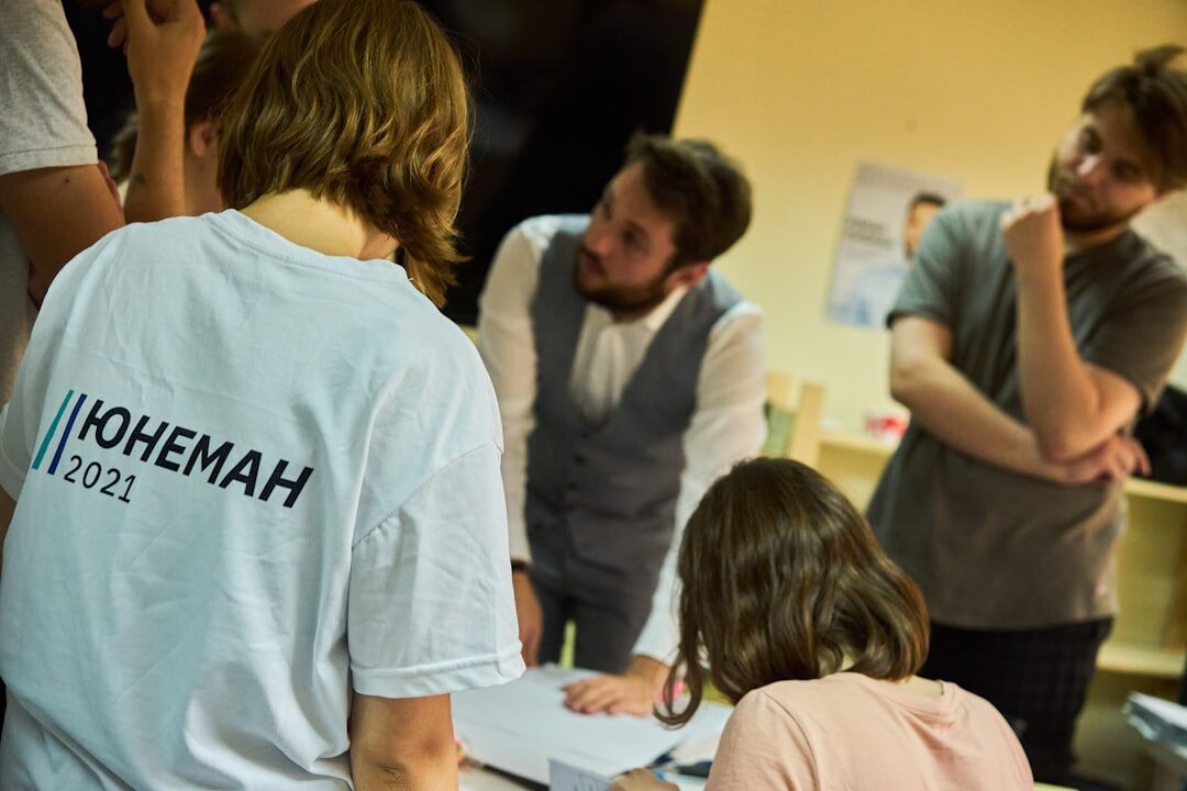 Group of journalism trainees in a workshop discussion