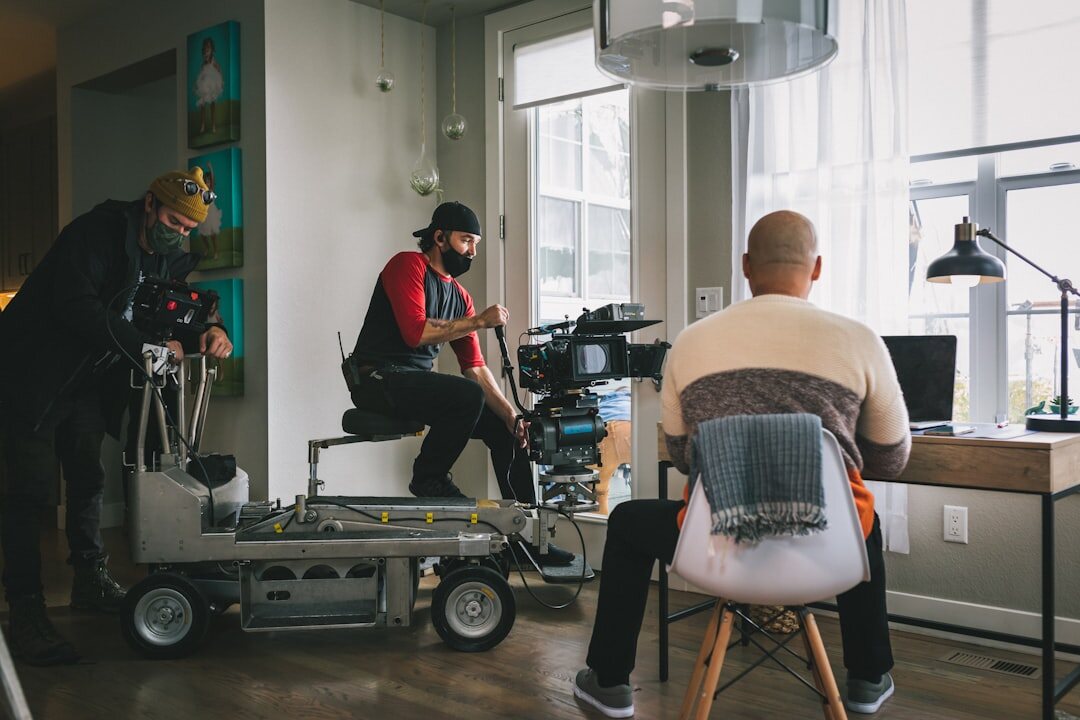 Team preparing a live broadcast with laptops and equipment
