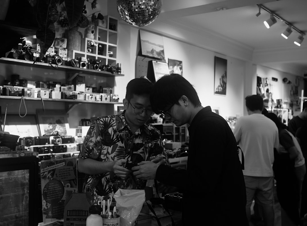 Journalist interviewing a local shop owner